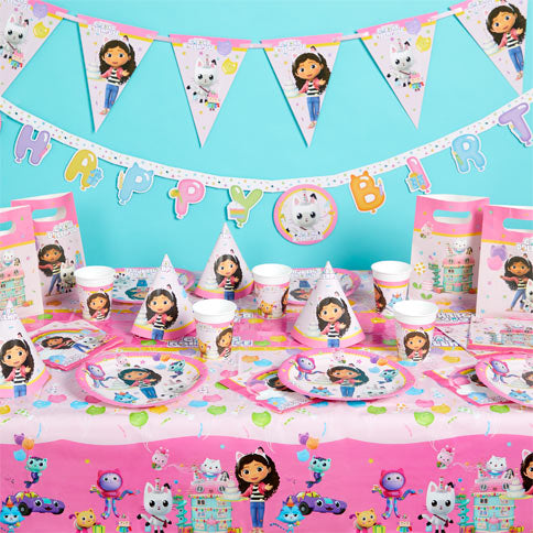 Gabbys dollhouse party supplies arranged in a styled party setting.